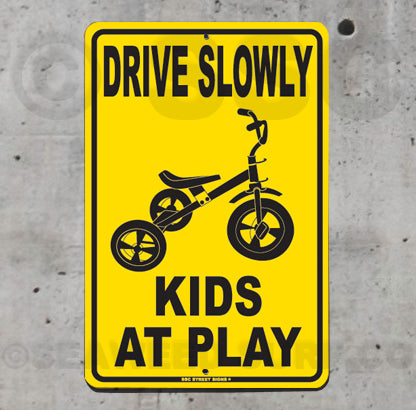 AA472 Drive Slowly Kids At Play - Tricycle - Seaweed Surf Sign Co
